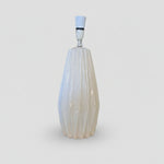 An elegant white ceramic table lamp with a faceted silhouette and glossy finish.