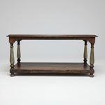 Wooden table with turned legs on a white background