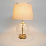 Luminous Clear Glass Globe Table Lamp with Brushed Brass Base