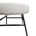 Minimalist Off White Fabric Round Footstool with Tapered Black Metal Legs
