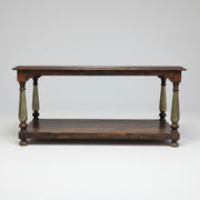 Wooden table with turned legs on a white background