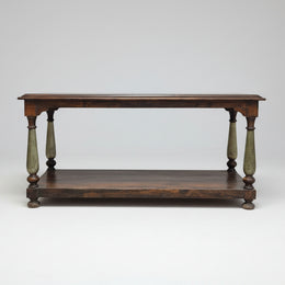 Wooden table with turned legs on a white background